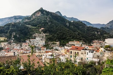 Obraz premium Amalfi Coast town overview with lemon trees and hillside housing