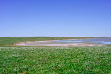 Salty steppe lake on the blue horizon, Kalmykia Republic of Russia