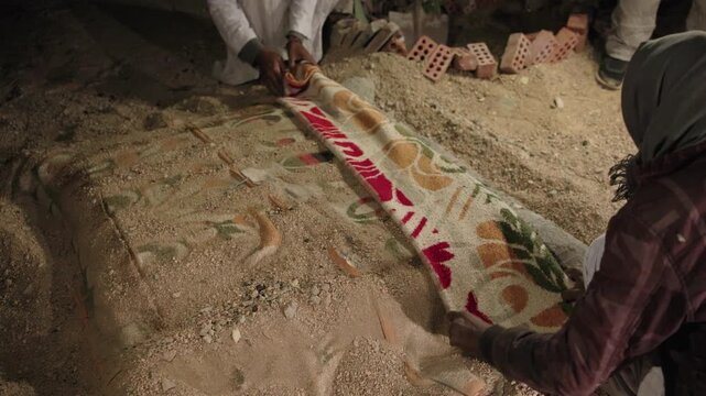 Bedouins uncover underground desert oven while preparing traditional food in Egypt