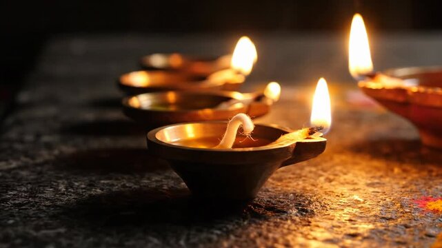 Row Of Lit Diyas Oil Lamps Glowing With Warm Orange Light On Dark Textured Surface With Soft Bokeh Background Traditional Indian Festival Lights Illuminated Deep Space Warm Glow Subtle Smoke