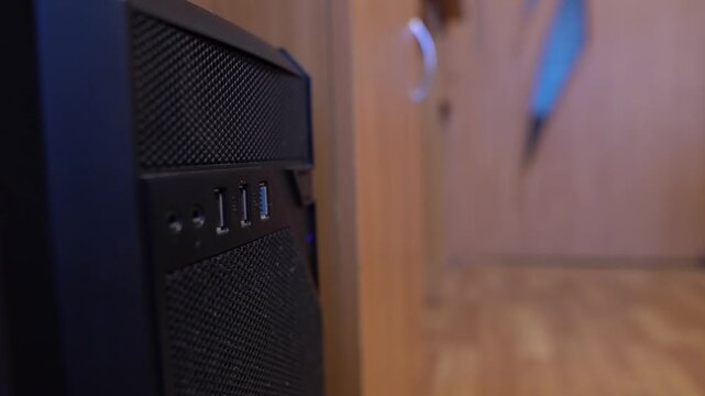 The blue flash drive is disconnected from the USB port of the computer in the office