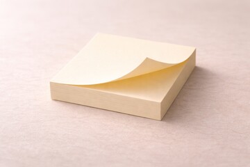 Blank sticky note pad with curling page symbolizing reminders, planning and new ideas