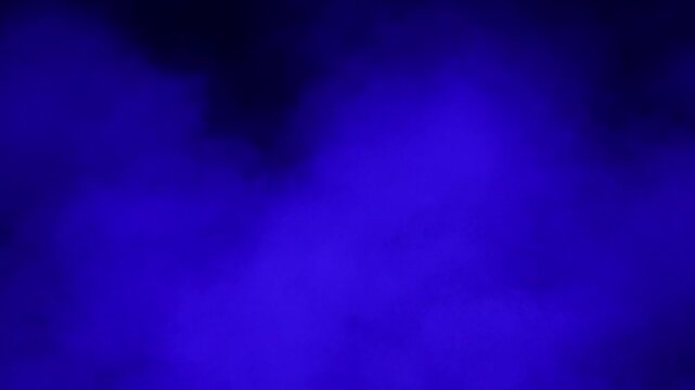 Blue smoke and dust on a black background. Fast-moving fog and smog 4K video