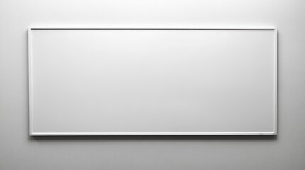 Obraz premium Empty white picture frame on a wall