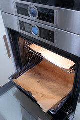 Modern kitchen electrical oven empty with oven paper domestic kitchen scene