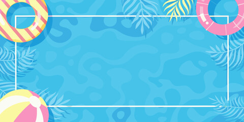 Summer themed background with inflatable toys and tropical leaves © Dibyendu