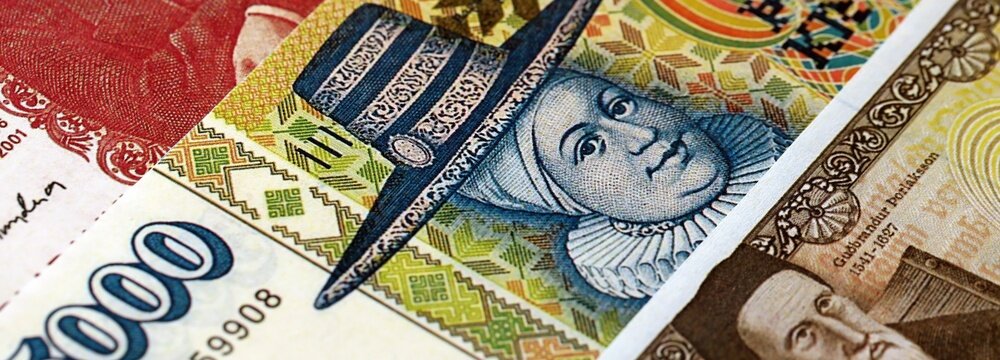Icelandic krona money bills pile on table. Iceland banknotes of ISK currency close up. Concept of business, economy and banking in Iceland