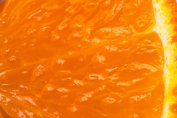 Macro Shot of Fresh Juicy Orange Pulp Texture,A detailed close-up showing the vibrant orange juice vesicles and fresh texture of a sliced citrus fruit, highlighting natural hydration and vitamin C.