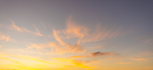 Breathtaking Vibrant Sunset Sky with Purple and Orange Pastel Clouds,A stunning twilight sky featuring a beautiful gradient of deep purple, soft pink, and vibrant orange. The scattered altocumulus.