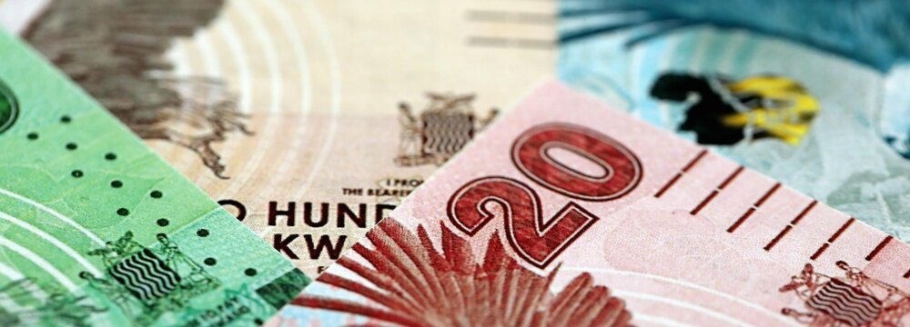 Zambian kwacha money bills pile on table. Zambia banknotes of ZMW currency close up. Concept of business, economy and banking in Zambia