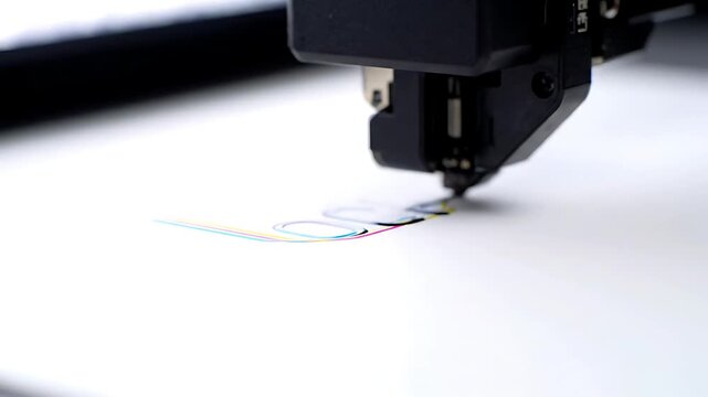Close-Up Industrial Plotter Printer Printing Multicolor Graphic