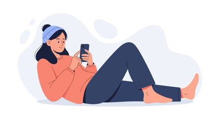 Fototapeta premium Young Woman Relaxing Indoors Using Smartphone, Cozy Winter Outfit