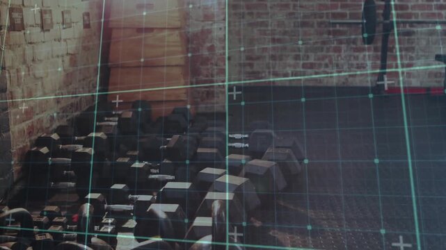 Camera panning right, revealing fitness room kettlebells and bench while teal grid tracking layout