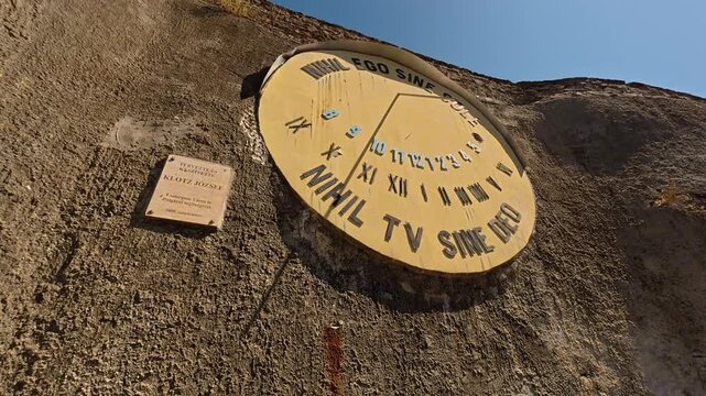 Esztergom, Hungary - 3 July 2025 - Large vertical sundial on a stone wall at Esztergom Castle