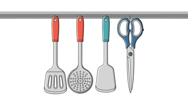 Set of colorful kitchen utensils including spatulas a skimmer and kitchen scissors hanging from a metal wall rail.