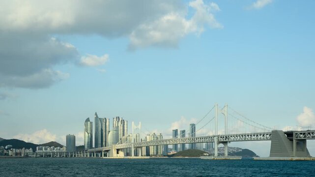Timelapse of Gwangan Bridge with Busan skyline and dramatic cloud movement