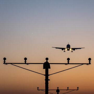 airport approach lighting system illuminating runway during sunset, bucharest, otp airport