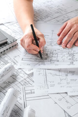 Architects concept, engineer architect designer freelance work on start-up project drawing, construction plan architect design working drawing sketch plans blueprints and making construction model