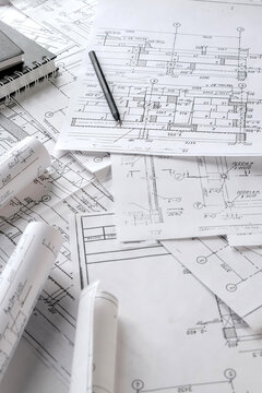 Architects concept, engineer architect designer freelance work on start-up project drawing, construction plan architect design working drawing sketch plans blueprints and making construction model