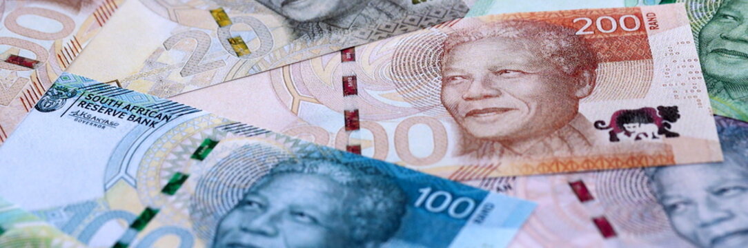 South African rand paper banknotes pile on table. South Africa ZAR currency money bills in big amount. Concept of economics, taxation and banking in South Africa