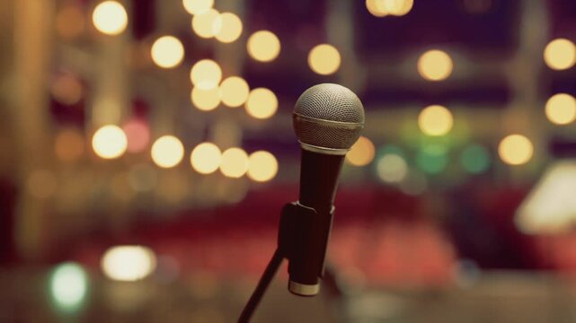 Vintage microphone against bokeh lights and blurred audience, ornate club vibes evoke cabaret or jazz night decorative mic head catches warm spotlight