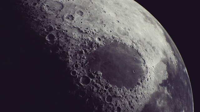 Glowing softly against the dark backdrop, the moon shows its rugged surface full of craters and shadows. Its beauty captivates stargazers on this clear, serene night.
