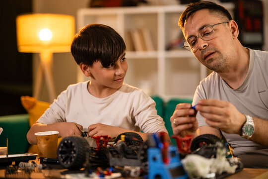 Father and son bonding building rc car toy