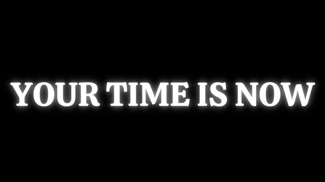 Glowing white text displaying the motivational phrase your time is now against a dramatic black background with bright light rays emanating outwards.