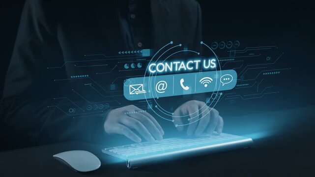 A close-up view of hands typing on a sleek keyboard, set against a dark backdrop, with a glowing digital interface showcasing contact options like email and phone. Qubit