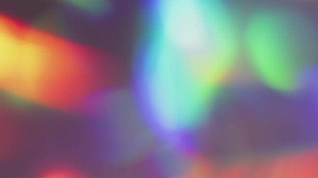 Defocused rainbow light. Gradient reflection. Abstract colorful glow mix on dark background. Red blue green holographic bright neon gleam optic effect .