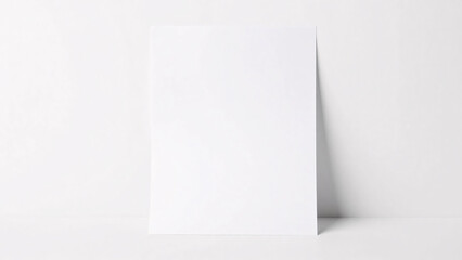 Naklejka premium A pristine, blank white book or magazine cover is shown from a top-down perspective against a matching white background, providing a clean and minimalist template for editorial branding and cover desi