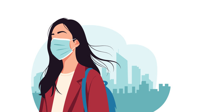 Young woman with long dark hair wearing a protective face mask and red coat walking in front of a city skyline with blue sky.