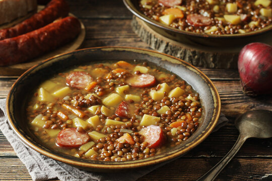A bowl with traditional German Linsensuppe lentil soup in rustic style	