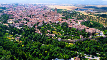 Obraz premium An aerial panorama view around the old town city Segovia on a sunny noon in Spain.