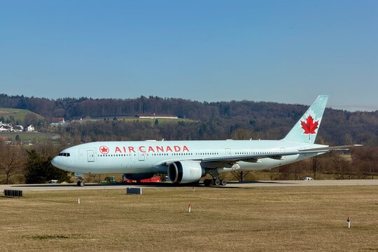 Zurich, Switzerland - February 25, 2026: Air Canada Boeing 777 taxiing on the taxiway toward the runway at Zurich Airport on a clear spring day.