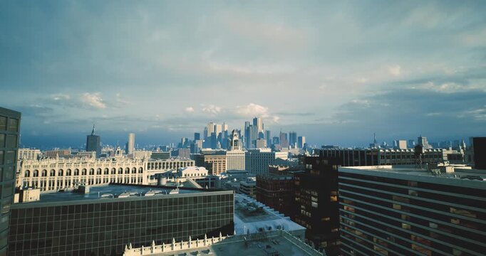 hazy winter skyline bathed in soft light with snow flecked rooftops and muted tones, gentle haze blending buildings into horizon, chilled atmosphere, subdued