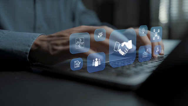 Partnership business strategy concept. Person using laptop with collaboration and business partnership icons, strategic alliance, corporate cooperation and business growth.