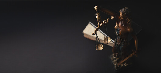 Law theme, mallet of judge, wooden gavel on black background