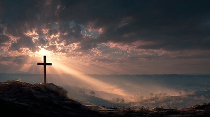 A serene landscape of a cross on a hill at sunset with rays of light