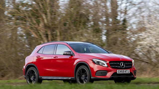Milton Keynes,Bucks,UK - Mar 1st 2026:  2020 red Mercedes Benz gla 200 amg line car driving on a British road