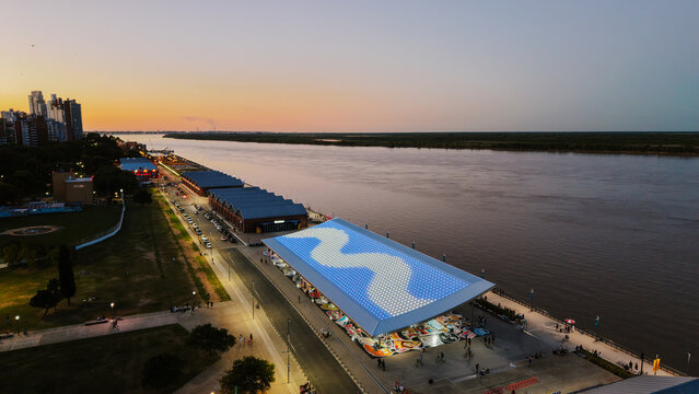 Sunset view of Rosario, Argentina, showing the Paran&aacute; River waterfront and the newly developed Costa Nueva public space "Aura"