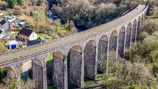 A close up rotating aerial view above the Cefn Coed Viaduct at Merthyr Tydfil, Wales, UK