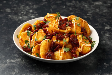 Patatas bravas with chorizo and sauce. Spanish traditional food