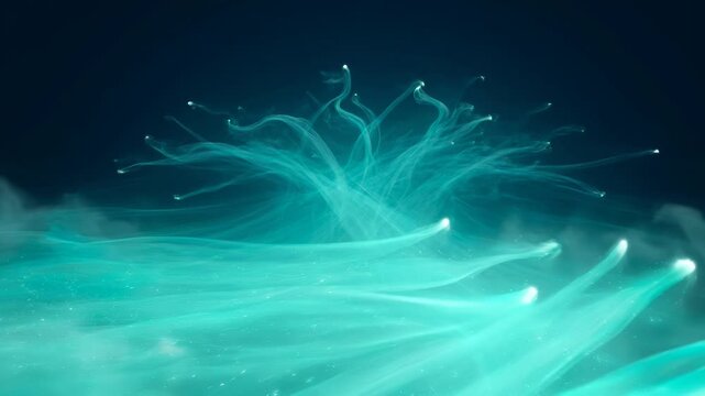 Abstract teal light painting with wisps of light floating upwards in darkness