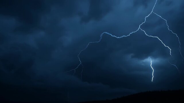 Dramatic lightning storm illuminating the dark and ominous night sky beautifully