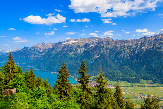 Breathtaking aerial view of Interlaken, Lake Brienz and Swiss Alps from Harder Kulm viewpoint, Switzerland
