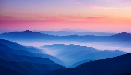 Fototapeta premium Serene Misty Mountain Range At Dawn With Soft Pink And Blue Hues