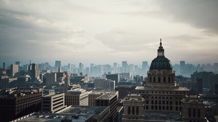 Obraz premium moody city panorama with historic dome, overcast sky and distant highrises, textured stone facade on classical building, sweeping rooftop perspective, urban