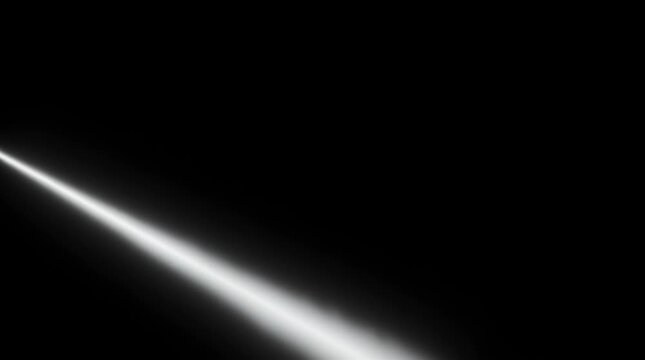 Light beam spotlight and illumination for dramatic effect in a dark studio setting with photographer capturing product details using professional lighting equipment Photography studio and artificial