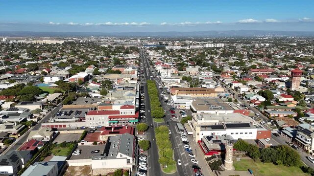 Semaphore Beach, North Adelaide, South Australia: 4K aerial drone footage of long jetty, sandy shoreline, ocean views, coastal park, houses, estates, streets and urban traffic, seaside atmosphere